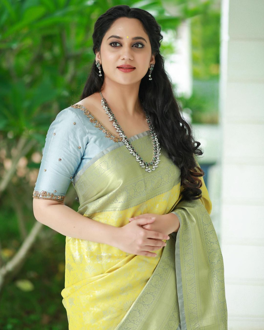 Actress Miya George Beautiful jewelry in Lemon Yellow Saree